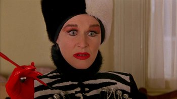 Movie still from “101 Dalmatians” (1996), directed by Stephen Herek – A woman in a zebra costume with a fur hat; Close Up shot, High angle