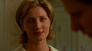 Movie still from “101 Dalmatians” (1996), directed by Stephen Herek – A woman's face in a room; Close Up shot, Over the shoulder angle