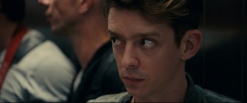 Movie still from “120 BPM” (2017), directed by Robin Campillo – A person looking at the camera; Close Up shot, Over the shoulder angle