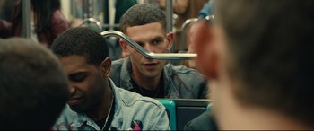 Movie still from “120 BPM” (2017), directed by Robin Campillo – A young man with a long metal fork in his mouth; Close Up shot, Over the shoulder angle