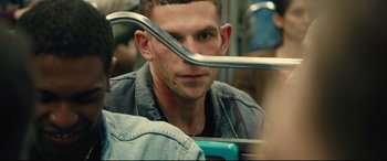 Movie still from “120 BPM” (2017), directed by Robin Campillo – A young man with a metal fork in his mouth; Close Up shot, Over the shoulder angle