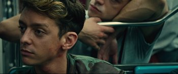 Movie still from “120 BPM” (2017), directed by Robin Campillo – A man getting his hair cut by another man; Close Up shot, Over the shoulder angle