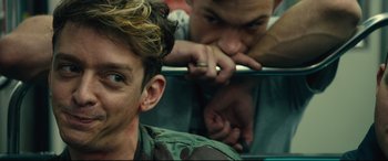 Movie still from “120 BPM” (2017), directed by Robin Campillo – Two men are looking at themselves in the same mirror; Close Up shot, Over the shoulder angle