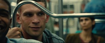 Movie still from “120 BPM” (2017), directed by Robin Campillo – A person holding a metal object on a bus; Close Up shot, Over the shoulder angle