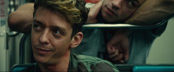 Movie still from “120 BPM” (2017), directed by Robin Campillo – A man sitting in front of another man with his face covered in blood; Close Up shot, Over the shoulder angle