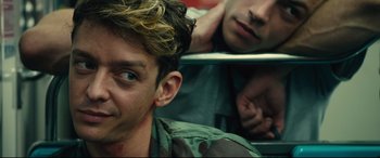 Movie still from “120 BPM” (2017), directed by Robin Campillo – A young man is looking at his reflection in a mirror; Close Up shot, Over the shoulder angle