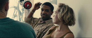 Movie still from “120 BPM” (2017), directed by Robin Campillo – A man and a woman sitting next to each other; Close Up shot, Over the shoulder angle