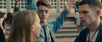 Movie still from “120 BPM” (2017), directed by Robin Campillo – A man and a woman are standing outside; Medium shot, Over the shoulder angle