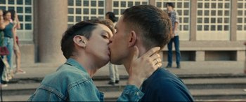 Movie still from “120 BPM” (2017), directed by Robin Campillo – A couple of people that are kissing in the street; Close Up shot, Over the shoulder angle
