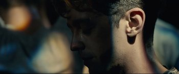 Movie still from “120 BPM” (2017), directed by Robin Campillo – A man's face with his eyes closed; Extreme Close Up shot, Low angle