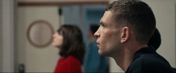 Movie still from “120 BPM” (2017), directed by Robin Campillo – A man and a woman are looking into the distance; Close Up shot, Over the shoulder angle