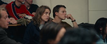 Movie still from “120 BPM” (2017), directed by Robin Campillo – A man and a woman sitting next to each other in a room; Close Up shot, Over the shoulder angle