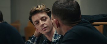 Movie still from “120 BPM” (2017), directed by Robin Campillo – A man looking at his reflection in a mirror; Close Up shot, Over the shoulder angle