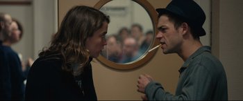 Movie still from “120 BPM” (2017), directed by Robin Campillo – A man and a woman face each other in front of a mirror; Medium shot, Over the shoulder angle