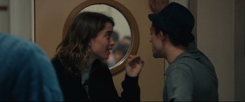 Movie still from “120 BPM” (2017), directed by Robin Campillo – A man and a woman talking to each other in front of a round mirror; Close Up shot, Over the shoulder angle