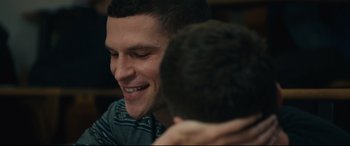 Movie still from “120 BPM” (2017), directed by Robin Campillo – A man smiling at another man; Close Up shot, Over the shoulder angle