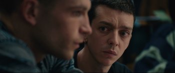Movie still from “120 BPM” (2017), directed by Robin Campillo – Two people looking at the camera; Close Up shot, Over the shoulder angle