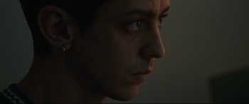 Movie still from “120 BPM” (2017), directed by Robin Campillo – A man's face in the dark; Close Up shot, Low angle