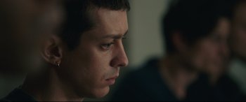 Movie still from “120 BPM” (2017), directed by Robin Campillo – A person looking down at something; Close Up shot, Over the shoulder angle