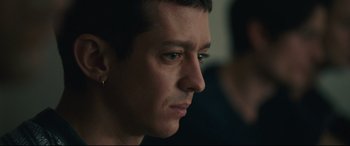 Movie still from “120 BPM” (2017), directed by Robin Campillo – A person looking at the camera; Close Up shot, Over the shoulder angle