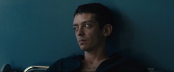 Movie still from “120 BPM” (2017), directed by Robin Campillo – A person wearing a black jacket; Close Up shot, High angle