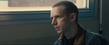 Movie still from “120 BPM” (2017), directed by Robin Campillo – A person on a train; Close Up shot, Over the shoulder angle
