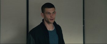 Movie still from “120 BPM” (2017), directed by Robin Campillo – A young man in a blue shirt and a black jacket; Close Up shot, Low angle