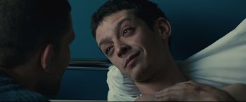 Movie still from “120 BPM” (2017), directed by Robin Campillo – A person laying on a bed; Close Up shot, Over the shoulder angle