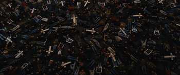 Movie still from “120 BPM” (2017), directed by Robin Campillo – A group of people laying on the ground with crosses on them; Extreme Wide shot, Overhead angle