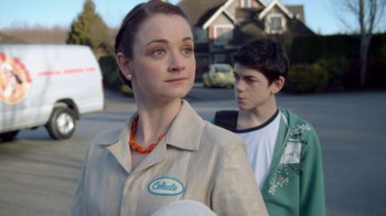 Movie still from “16 Wishes” (2010), directed by Peter DeLuise – A woman and a boy standing in a parking lot; Close Up shot, Over the shoulder angle
