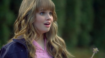 Movie still from “16 Wishes” (2010), directed by Peter DeLuise – A girl with long blonde hair wearing a pink shirt; Close Up shot, Over the shoulder angle