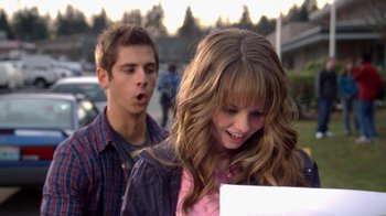 Movie still from “16 Wishes” (2010), directed by Peter DeLuise – A young girl and a young man standing next to each other on the street; Close Up shot, Over the shoulder angle