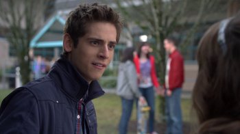 Movie still from “16 Wishes” (2010), directed by Peter DeLuise – A young man standing in front of a group of young people; Close Up shot, Over the shoulder angle