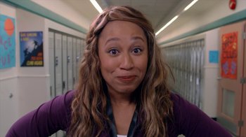 Movie still from “16 Wishes” (2010), directed by Peter DeLuise – A person with long brown hair; Close Up shot, Over the shoulder angle