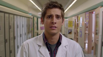 Movie still from “16 Wishes” (2010), directed by Peter DeLuise – A man in a white lab coat standing in a hallway; Close Up shot, Over the shoulder angle