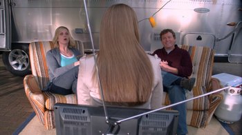 Movie still from “16 Wishes” (2010), directed by Peter DeLuise – Two women and a man sitting in front of a laptop; Medium shot, Over the shoulder angle