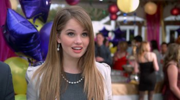 Movie still from “16 Wishes” (2010), directed by Peter DeLuise – A beautiful young lady with long brown hair wearing a necklace; Close Up shot, Over the shoulder angle