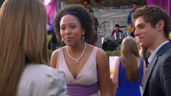 Movie still from “16 Wishes” (2010), directed by Peter DeLuise – A woman in a purple dress; Close Up shot, Over the shoulder angle