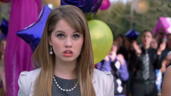 Movie still from “16 Wishes” (2010), directed by Peter DeLuise – A woman with long brown hair wearing a white jacket; Close Up shot, Over the shoulder angle