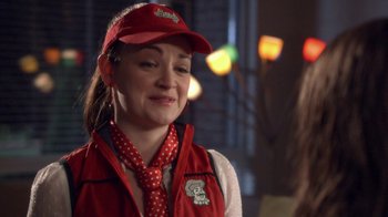 Movie still from “16 Wishes” (2010), directed by Peter DeLuise – A woman wearing a red hat and a red vest; Close Up shot, Over the shoulder angle