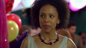 Movie still from “16 Wishes” (2010), directed by Peter DeLuise – A person wearing a necklace; Close Up shot, Over the shoulder angle