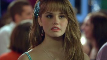 Movie still from “16 Wishes” (2010), directed by Peter DeLuise – A person with long brown hair; Close Up shot, Over the shoulder angle
