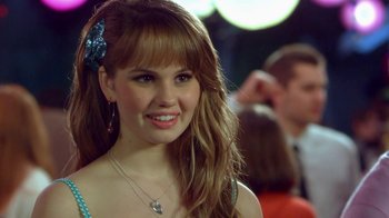 Movie still from “16 Wishes” (2010), directed by Peter DeLuise – A beautiful young lady with a smile on her face; Close Up shot, Over the shoulder angle