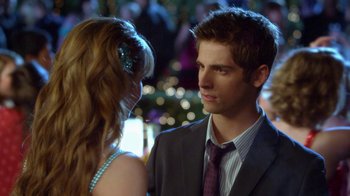 Movie still from “16 Wishes” (2010), directed by Peter DeLuise – A man and a woman in formal wear looking at one another; Close Up shot, Over the shoulder angle