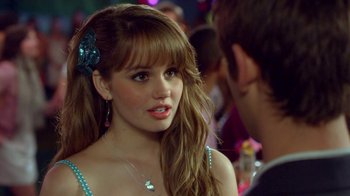 Movie still from “16 Wishes” (2010), directed by Peter DeLuise – A young woman with bangs talking to a young man; Close Up shot, Over the shoulder angle