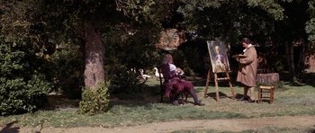 Movie still from “1776” (1972), directed by Peter H. Hunt – An older woman sitting on a chair next to an easel; Wide shot, Over the shoulder angle