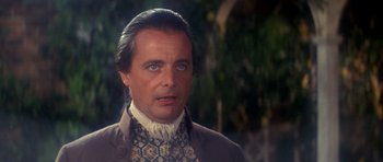 Movie still from “1776” (1972), directed by Peter H. Hunt – A person wearing a suit and tie; Close Up shot, Over the shoulder angle