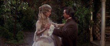 Movie still from “1776” (1972), directed by Peter H. Hunt – A man and a woman dressed in period clothing; Medium shot, High angle