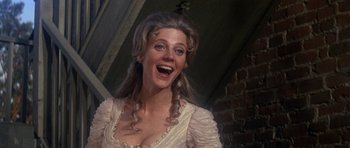 Movie still from “1776” (1972), directed by Peter H. Hunt – A woman in a white dress is laughing; Close Up shot, Low angle