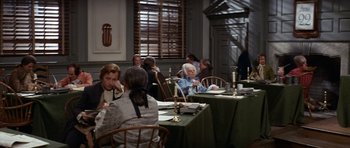 Movie still from “1776” (1972), directed by Peter H. Hunt – A group of people sitting at a dinner table; Wide shot, High angle